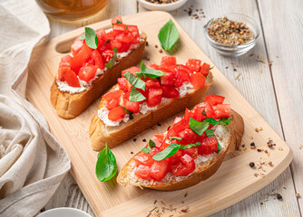 Sandwiches with tomato, feta and basil, traditional bruschetta.