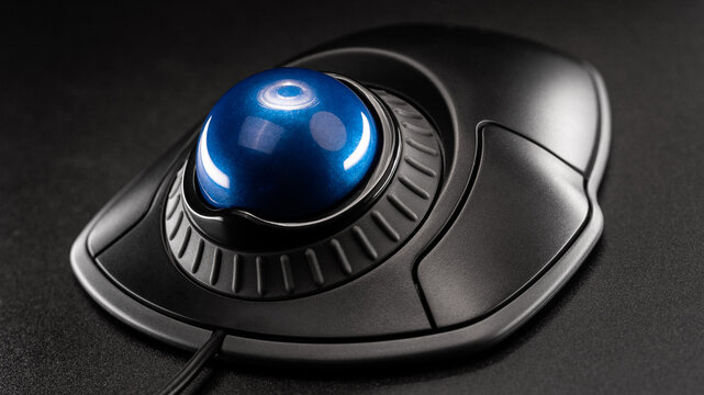 Trackball Computer Mouse on a black background. Control Device with Scroll Wheel