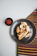 food dinner cookies kurze on a plate with red sous white and colorful background 