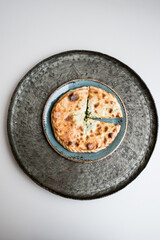 slices of herb pie on the silver plate 