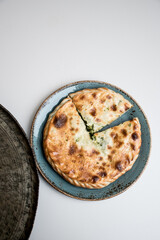 slices of herb pie on the silver plate 