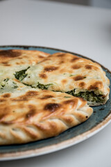 slices of herb pie on the silver plate 