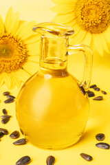 Sunflower oil, seeds and flower isolated on white background.