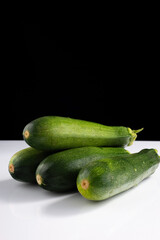 zucchini zucchini on black and white background. Minimalistic concept