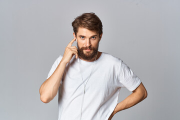 man in white t-shirt with beard lifestyle casual wear Studio light background