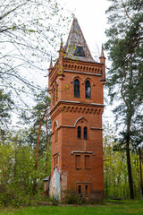 Naklejka premium Old brick water tower in Natalyevka park in Kharkiv region, Ukraine