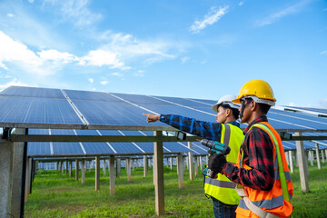 Engineer working on checking equipment in solar power plant,solar power plant to innovation of green energy for life.