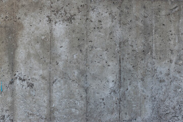 Reinforced concrete texture. Surface of old and dirty reinforced concrete with traces of wooden formwork.