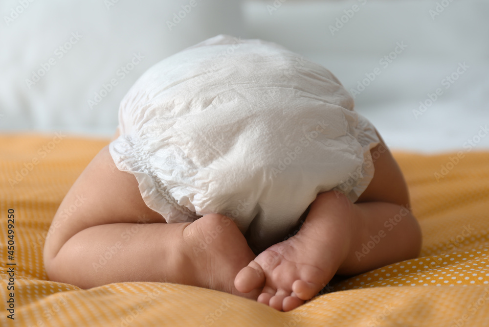 Sticker cute little baby in diaper on yellow blanket