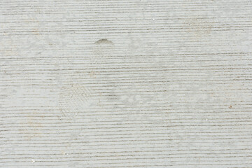 Footprint human on footpath concrete