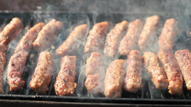 Grilling Delicious Kebabs on Charcoal Barbecue Grill