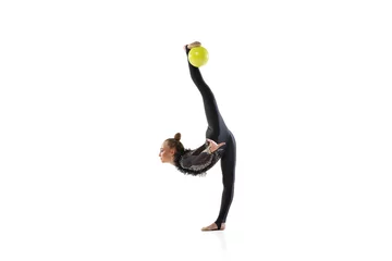 Foto op Canvas Young female athlete, rhythmic gymnastics artist isolated on white studio background. Beautiful girl practicing with ball. Concept of sport, action, aspiration © master1305