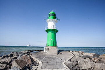 Fototapeta na wymiar lighthouse on the coast in Warnemünde Germsnx
