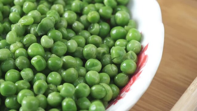 Fresh organic peas in a bowl ,