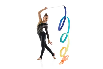 Schilderijen op glas Portrait of little girl, rhythmic gymnastics artist training with colored ribbon isolated on white studio background. Concept of sport, action, aspiration © master1305