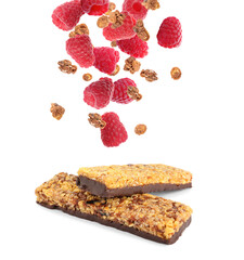 Tasty protein bars and granola with raspberries falling on white background