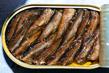 Baltic Sea Sprats in the can with oil . Caloric and unhealthy food