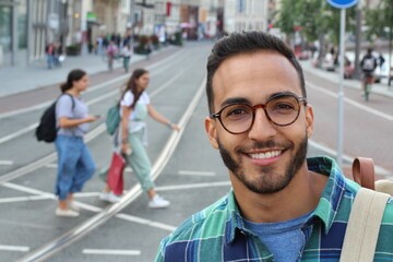 Young ethnic adult walking on the street 