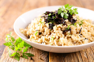 bowl of mushroom risotto and parsley