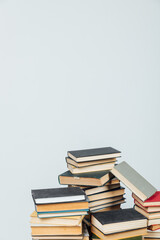 Stacks of books for teaching knowledge of the college school library white background