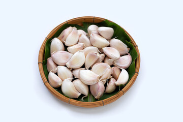 Garlic in bamboo basket on white background