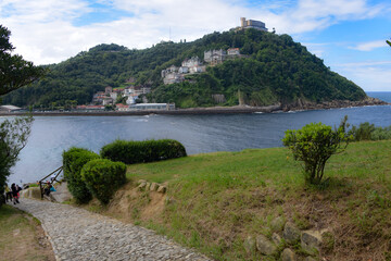 San Sebastian, Spain - 2 August 2021: Views of Monte Igueldo from Isla Santa Clara and La Concha Bay
