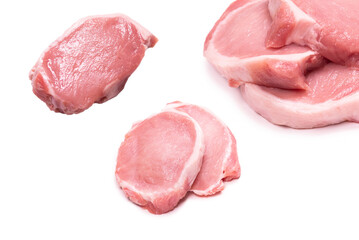 Raw pork pieces isolated on a white background.