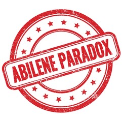 ABILENE PARADOX text on red grungy round rubber stamp.