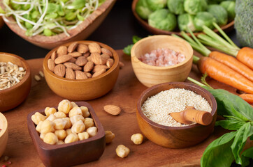 Different vegetables, seeds and fruits on table. Healthy diet..vegetarian, vegan food cooking ingredients. Flat-lay of vegetables, fruit, beans, cereals, kitchen utencil, dried flowers, top view.