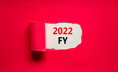 2022 FY fiscal new year symbol. Words '2022 FY fiscal year' appearing behind torn purple paper. Beautiful purple background. Business, 2022 FY fiscal new year concept, copy space.