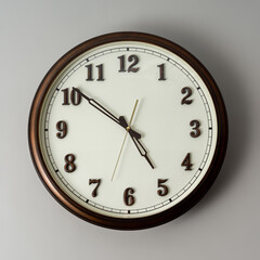 Wall clock on gray background.
