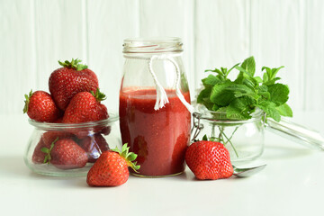 strawberry jam in a glass jar.Summer mood.