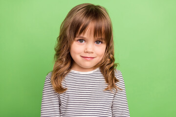 Photo of pretty small blond hair girl wear striped shirt isolated on green color backgound