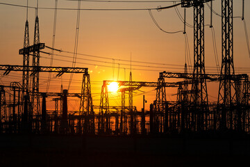 Power line at sunset. Power transmission station