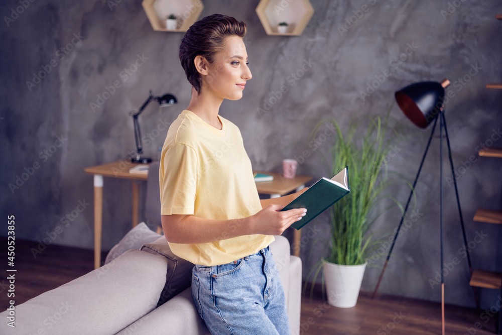 Poster Photo of young calm peaceful woman hold hand book rest weekend casual outfit indoors inside house home flat