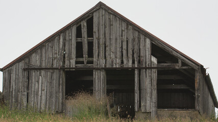 Old broken barn in the field.