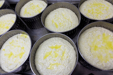 phases of Greek feta cheese production in a cheese factory in Greece