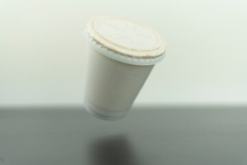 Flying white cafe cup