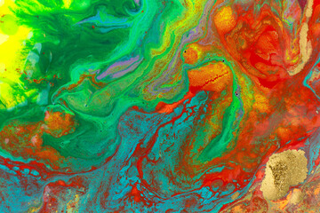 Gold spots on rainbow smudges of paint. Abstract pattern.