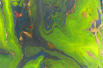 Green and violet marble abstract acrylic background. Vivid artwork texture. Agate ripple pattern.