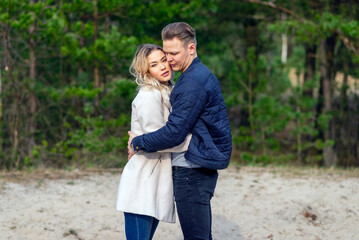 Fototapeta premium Happy loving couple enjoying of happiness love and tenderness, dating, romance.Couple hugging in love at spring park.