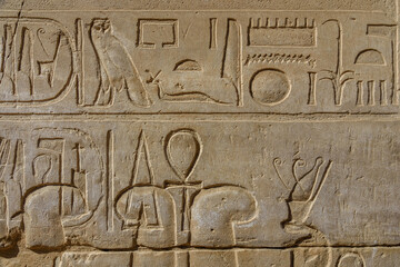 Egyptian ancient hieroglyphs on the stone wall