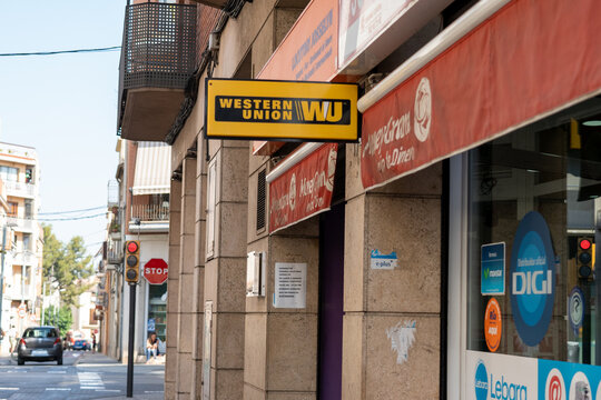 Barcelona, Spain, August 3 2021: wester union poster in a store