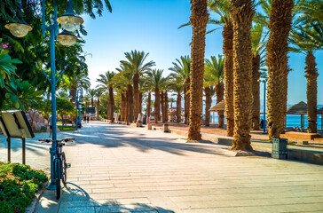 Central promenade near a public beach in Eilat - famous tourist resort and recreational city in...