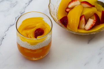 Sweet tapioca pudding with fresh mango and strawberry