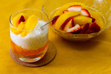Sweet tapioca pudding with fresh mango and strawberry