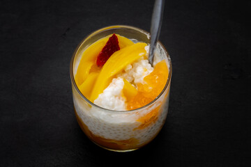 Sweet tapioca pudding with fresh mango and strawberry