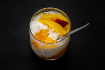 Sweet tapioca pudding with fresh mango and strawberry