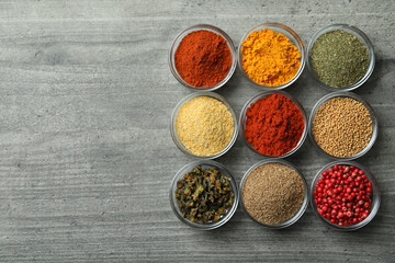 Set of different spices in glass bowls