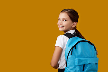 adorable schoolgirl with backpack. Back to school